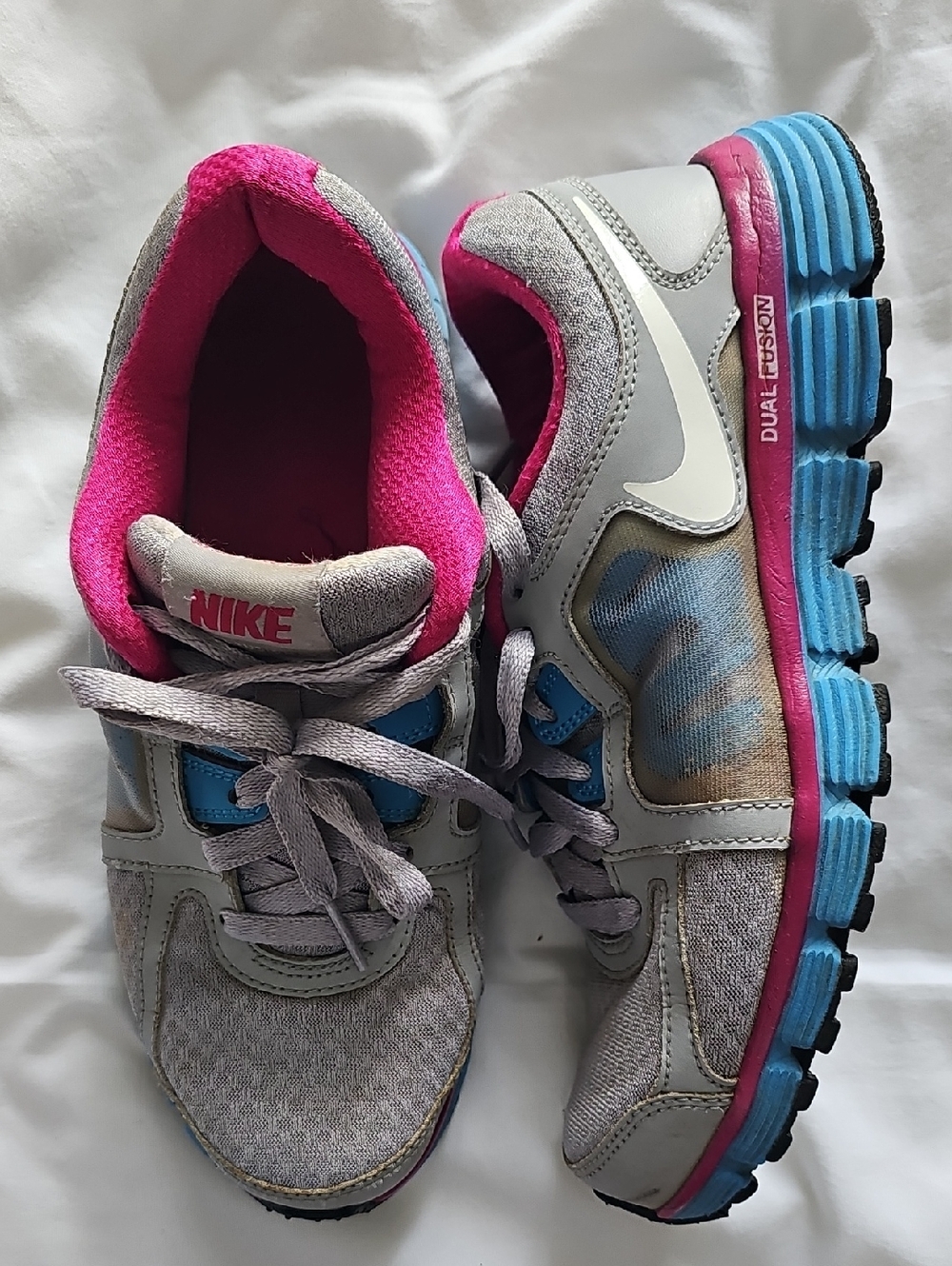 Nike Women's Gray Sneakers with Pink Lining and Blue Accents